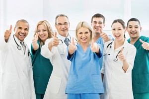 Doctors showing thumbs up.